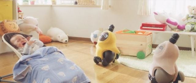 Lovot robots watch over baby