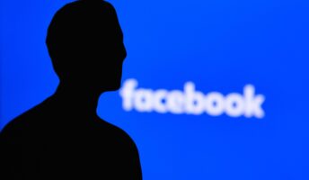 Facebook logo with Zuckerberg silhouette
