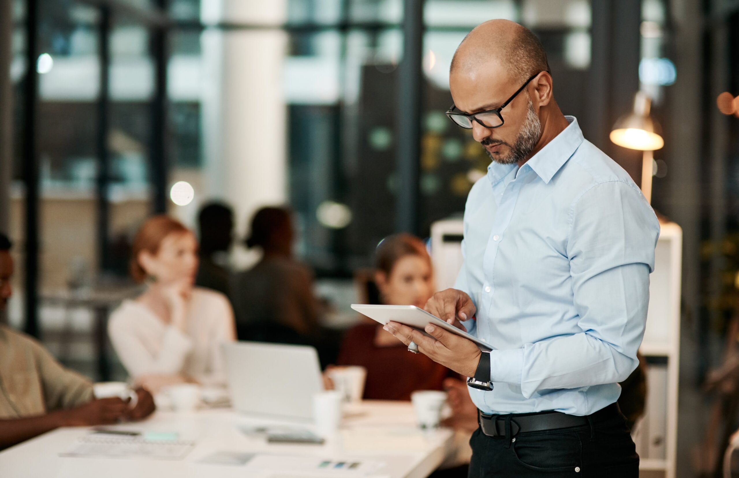 Man on tablet in office